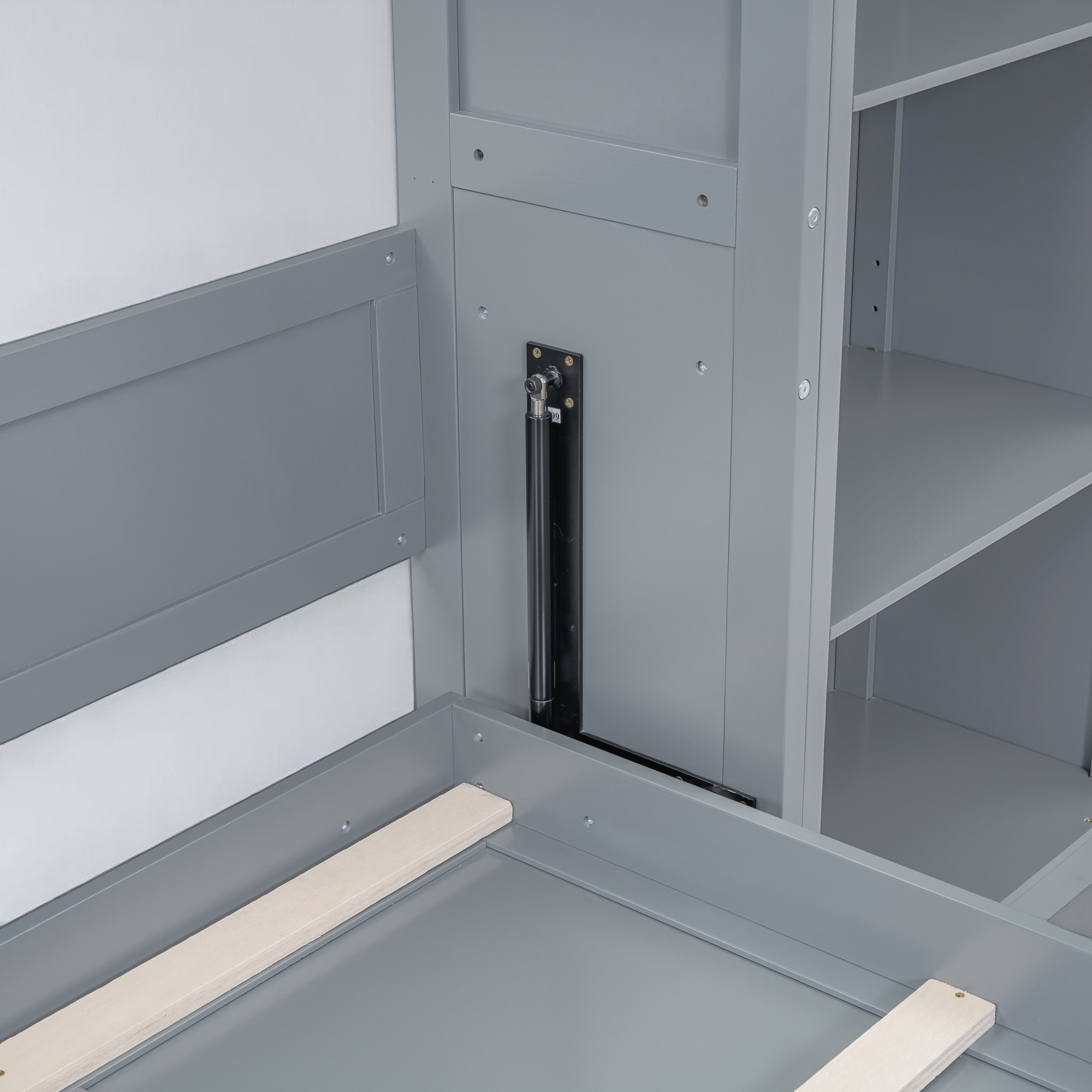 Detail of the cabinet door panel and structural elements of the Murphy bed.