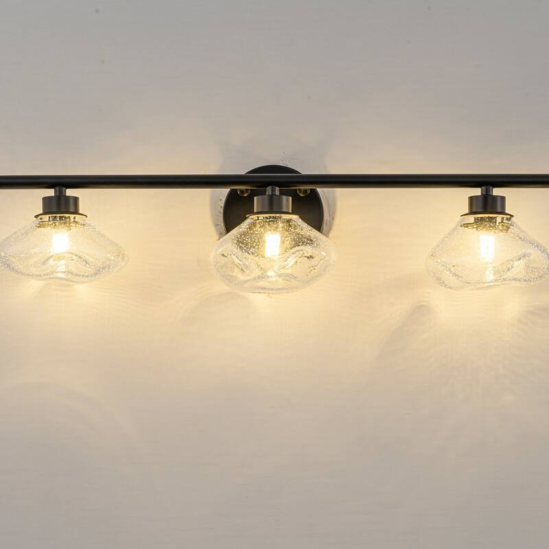 3-Light 24.4" Modern Black/Gold Bathroom Vanity Light with Stone-Shaped Seed Glass Shades