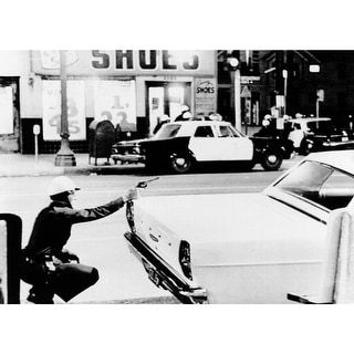 1965 Watts Riots. A Policeman Aims His Revolver At Building Where A ...