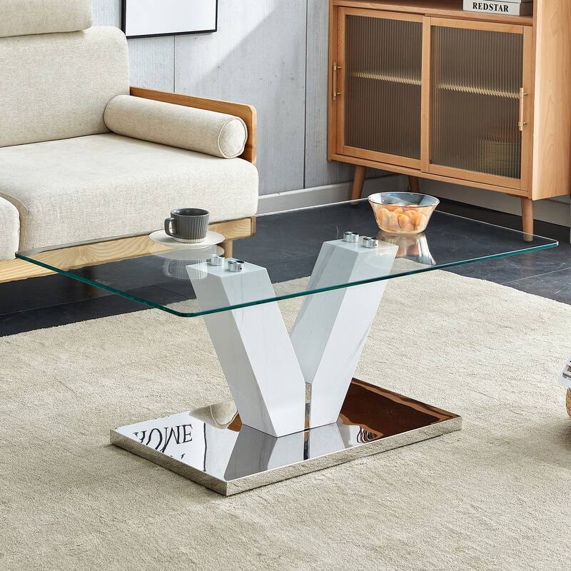 A modern minimalist style coffee table. Transparent tempered glass tabletop with wooden MDF columns