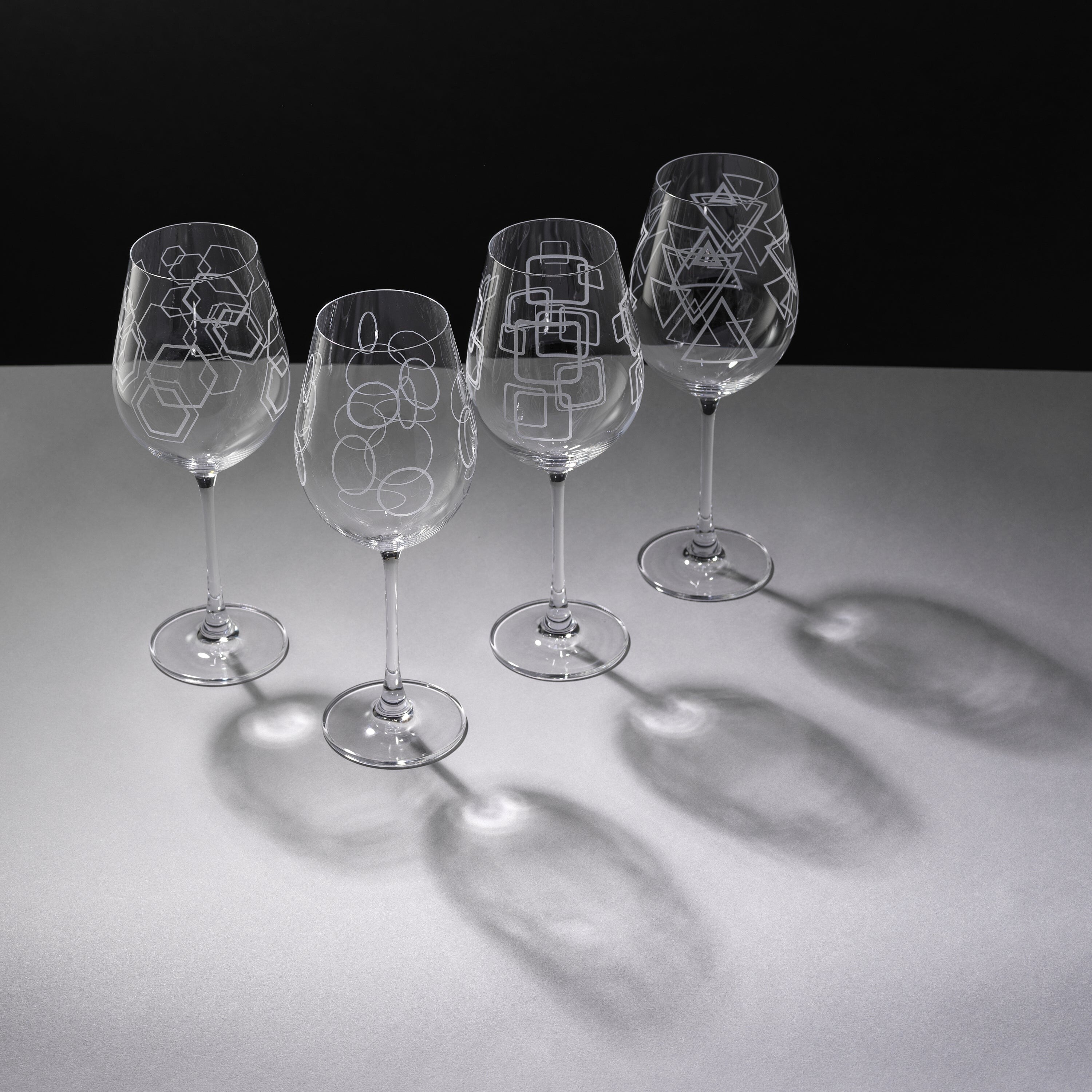 https://ak1.ostkcdn.com/images/products/is/images/direct/940c2b19607a45f8ea86d15e20d78aadecc4e91f/JoyJolt-Geo-Crystal-White-Wine-Glasses---14-oz---Set-of-4.jpg