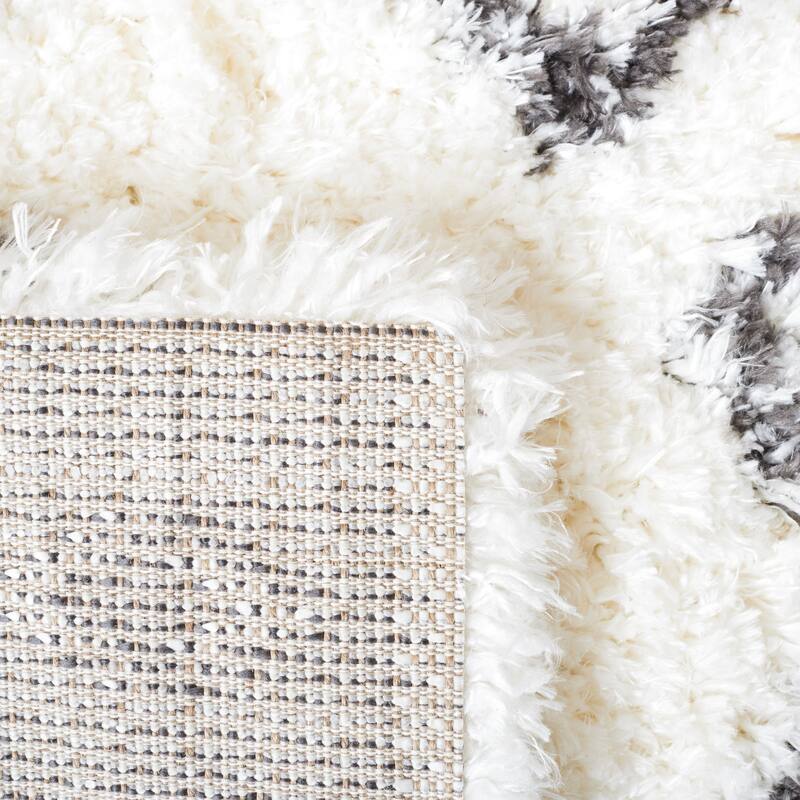 SAFAVIEH Handmade Flokati Theresie Shag Solid Polyester Rug