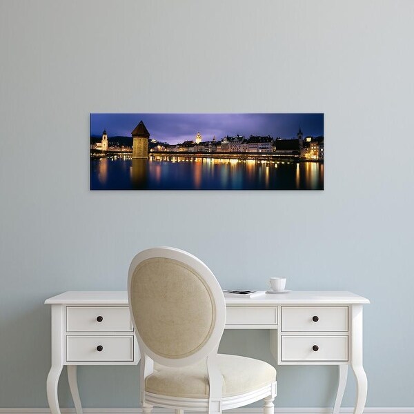 Easy Art Prints Panoramic Image 'Buildings lit up at dusk, Chapel Bridge, Reuss River, Lucerne, Switzerland' Canvas Art