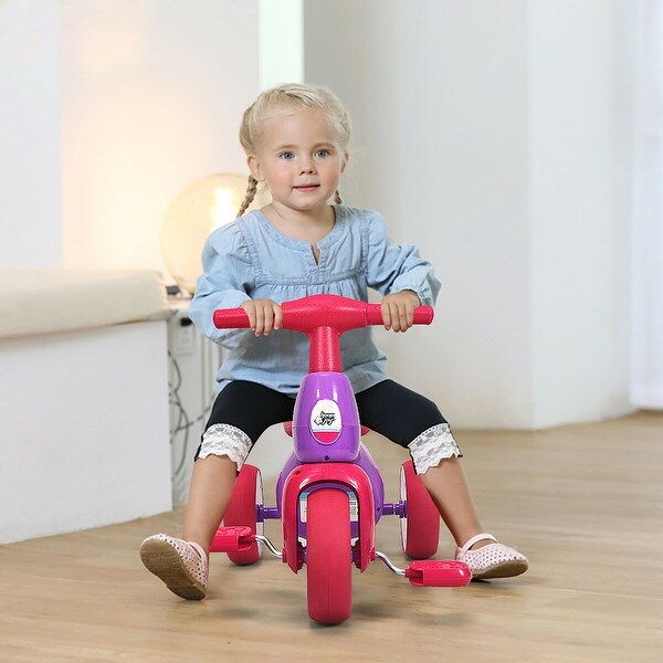 child riding tricycle