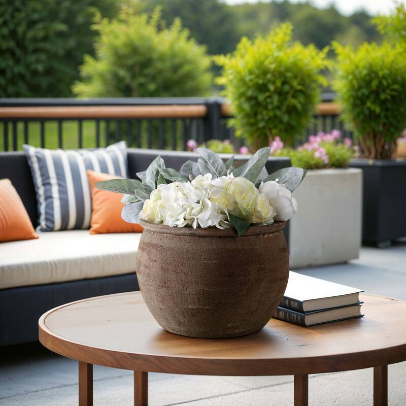 Terracotta Planter with Rounded Silhouette and Textured Surface