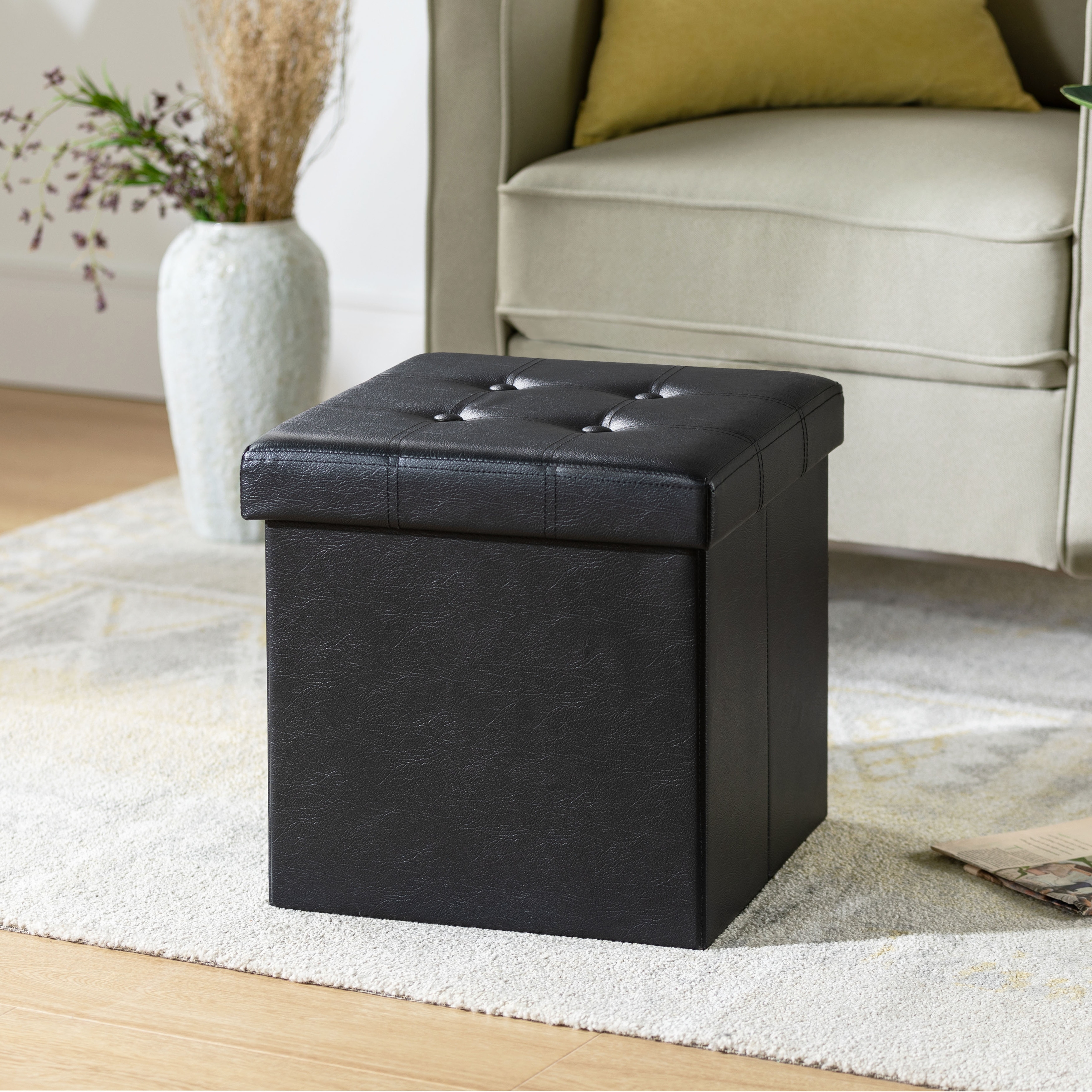 https://ak1.ostkcdn.com/images/products/is/images/direct/963f446233e24aa58abe68e541a2f44ecbcb851a/15-Inch-Button-Tufted-Faux-Leather-Collapsible-Storage-Ottoman-By-Crown-Comfort.jpg