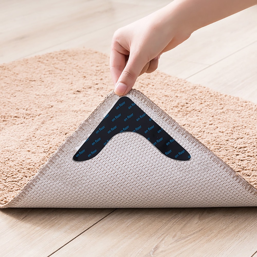 https://ak1.ostkcdn.com/images/products/is/images/direct/975399b1bb8a8499796108d29ffdac1fcc7982aa/pro-space-Rug-Pads-Grippers-Carpet-Tape-4-Pcs-Non-Slip-Rug-Tape-for-Hardwood-Floors-and-Tiles%2C-Keep-Your-Rug-in-Place.jpg