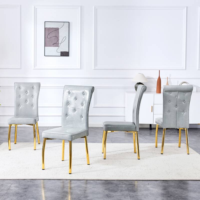 A set of 4 white and black vintage crocodile leather cushioned dining chairs, featuring crystal clasp design and leather