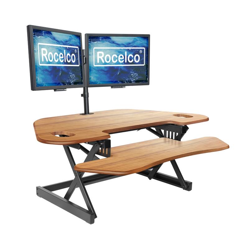 Rocelco 46 in. W Beige Height Adjustable Corner Standing Desk Converter Dual Monitor Riser with Gas Spring Assist System