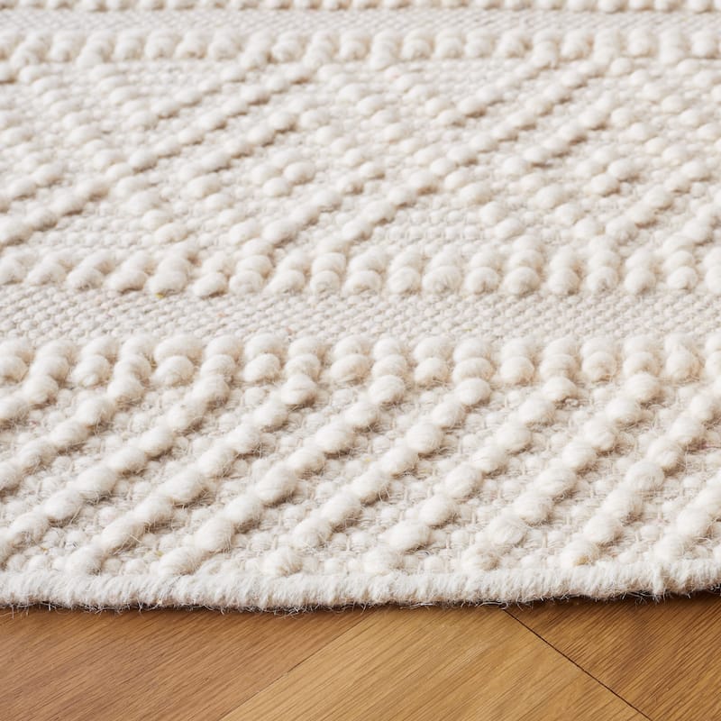 SAFAVIEH Handmade Natura Mette Wool Braided Tassel Rug
