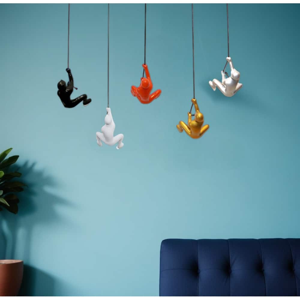 HomeRoots Set of Five Black Gold Orange Silver And White Resin Climbing Man Hanging Dimensional Sculpture