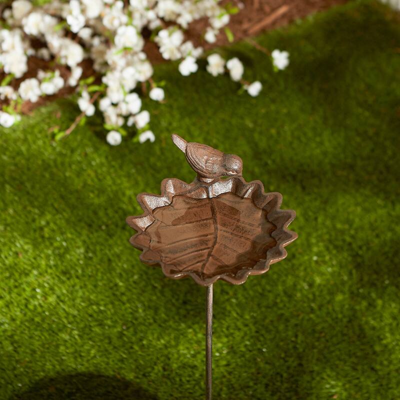 Bird Nesting On Shovel Birdbath