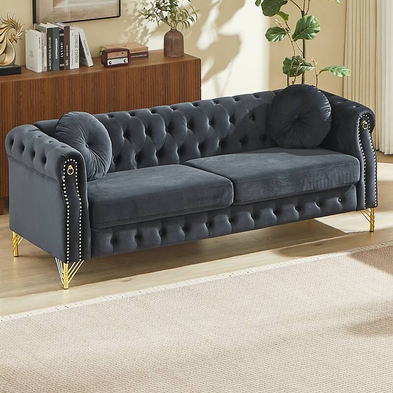 Chesterfield Sofa with Two Round Pillows, Featuring Copper Stud Detailing and Tufted Button Accents