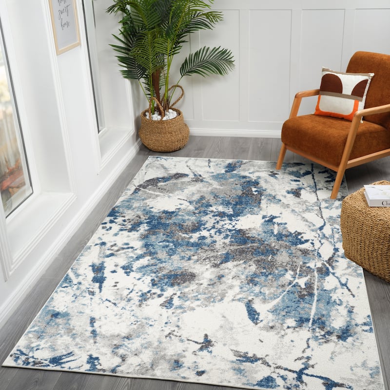Avant Ivory and Blue Abstract Power-Loom Area Rug 2' x 3'