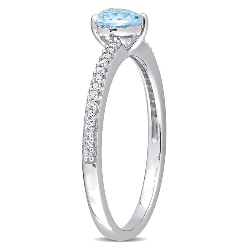 Miadora 10k White Gold Heart-cut Blue Topaz and 1/10ct TDW Diamond Birthstone Ring