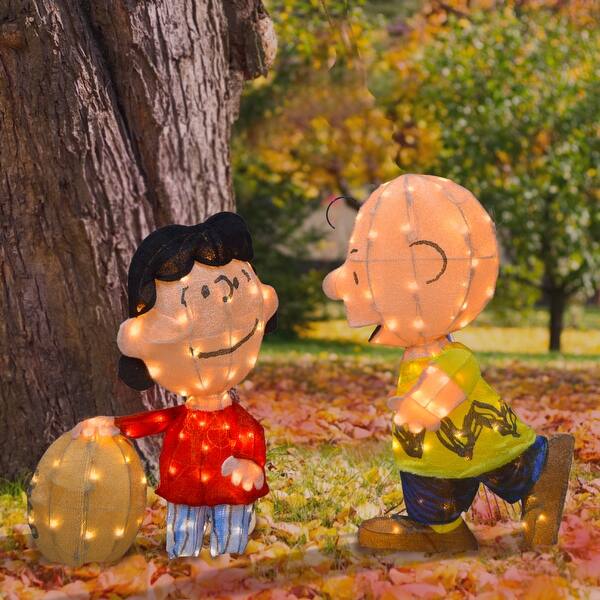 slide 2 of 5, Set of Two 32" Peanuts 3D Pre-Lit LED Yard Art Lucy with Football and Charlie Brown