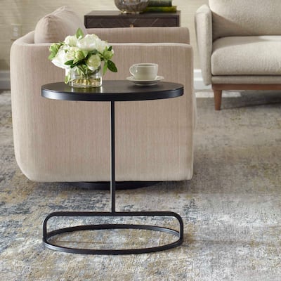 Strick & Bolton Aged Black Aluminum Oval Accent Table
