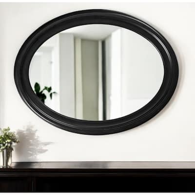 HomeRoots 33" Black Oval Framed Accent Mirror - 33" H x 25" W