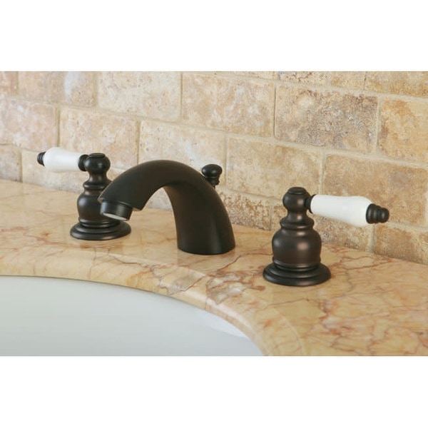 Kingston Brass KB94.B Victorian Mini-Widespread Bathroom Faucet with Pop-Up Drain Assembly and Porcelain Lever Handles