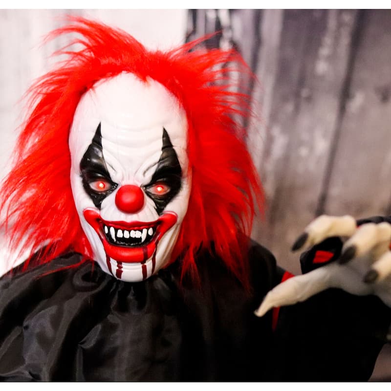 Haunted Hill Farm 5-ft. Animatronic Clown, Indoor/Covered Outdoor Halloween Decoration, Red LED Eyes, Poseable, Hell Raiser