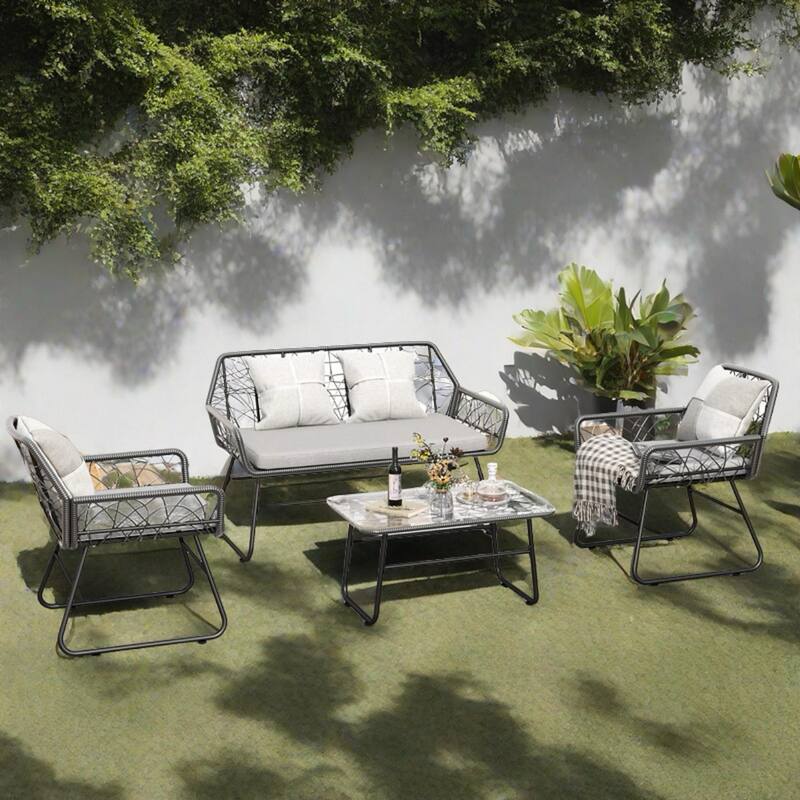 4-Piece Outdoor Rattan Sofa Set with Glass Table & Waterproof Cushions