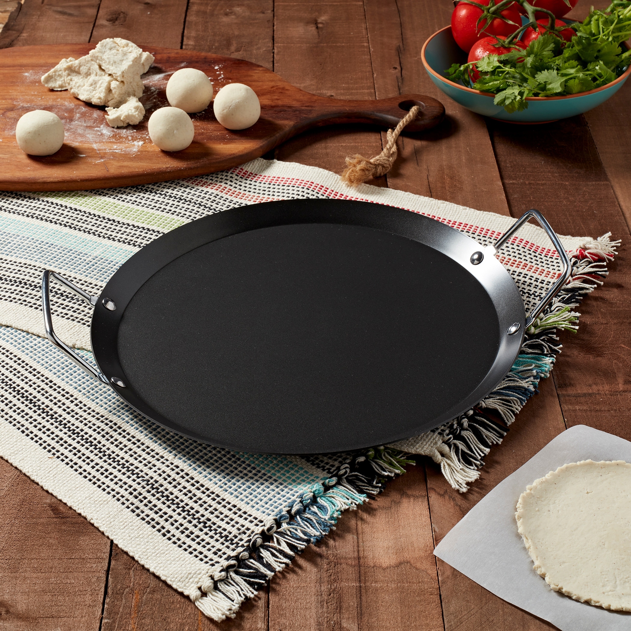https://ak1.ostkcdn.com/images/products/is/images/direct/9ba22cbd90efdbc4466b20f371b4bdfa56d8705a/Infuse-13-inch-Round-Carbon-Steel-Comal---Griddle.jpg