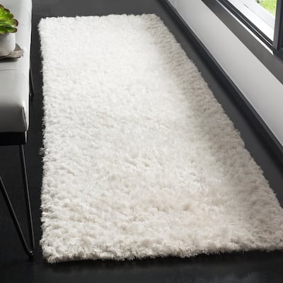 SAFAVIEH Handmade Saint Tropez Shag Yuiko Solid Polyester Rug
