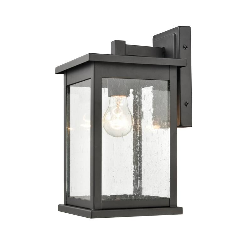 Millennium Lighting Bowton 1 Light Outdoor Wall Sconce in Powder Coat Black with Clear Glass Shade