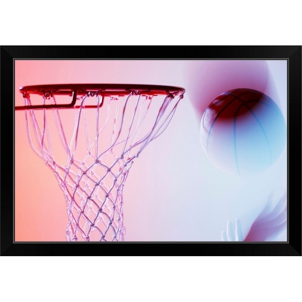 "Blurred view of basketball going into hoop" Black Framed Print