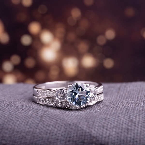Miadora 10k White Gold Aquamarine Created White Sapphire 1/7ct TDW Diamond 3-stone Bridal Ring Set. Opens flyout.