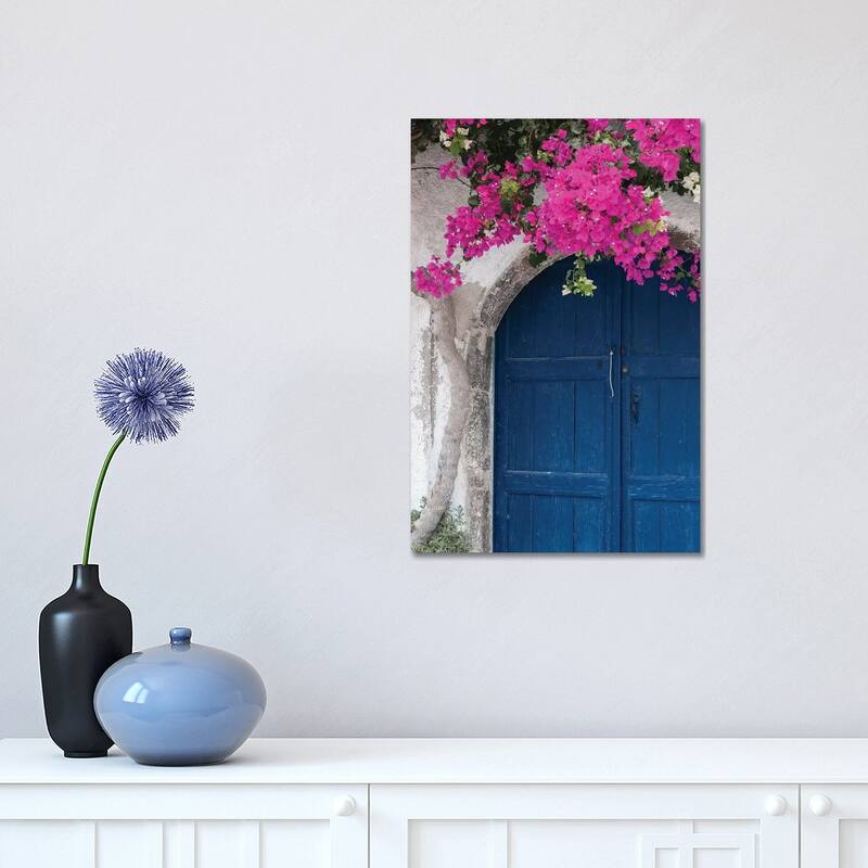 iCanvas "Greece, Santorini. Weathered blue door is framed by bright pink Bougainvillea blossoms." by Brenda Tharp Canvas Print - 18x12x1.5