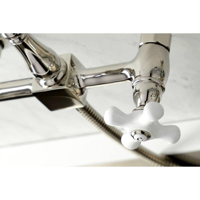 Kingston Brass Heritage Wall Mount Bridge Kitchen Faucet with Brass Sprayer