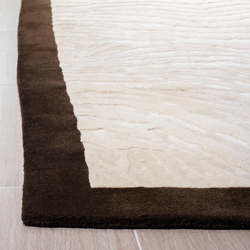 SAFAVIEH Handmade Soho Amberly Zebra N.Z. Wool Rug