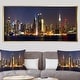 preview thumbnail 11 of 14, Designart 'New York Skyline at Night' Cityscape Photo Framed Canvas Print 60 in. wide x 28 in. high - Gold