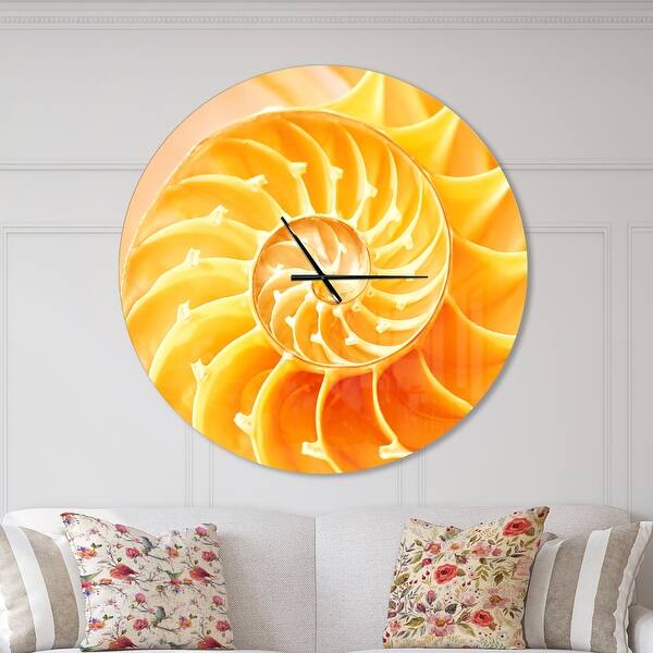 slide 2 of 10, Designart 'Yellow Nautilus Shell' Oversized Coastal Wall CLock