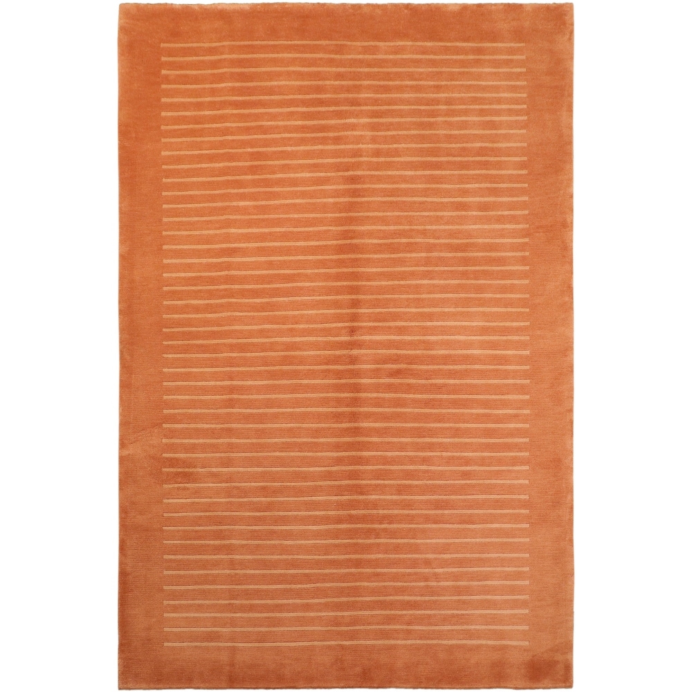 https://ak1.ostkcdn.com/images/products/is/images/direct/9ee752c79591d5c6ba633371f35266958803dd88/Nepalese-Art-Deco-Cohen-Rust-Tan-Wool-Rug-%286%270%27%27-x-9%270%27%27%29.jpg