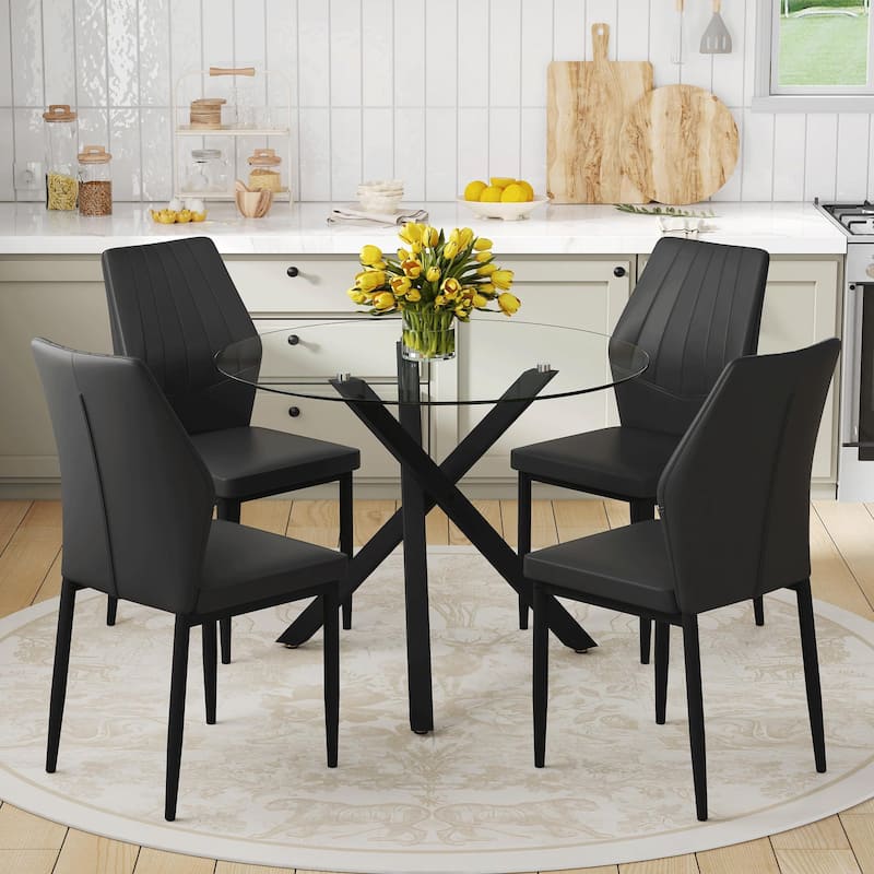 Table and chair set.Modern glass round table: X-shaped black metal bracket. Paired with 4 Dining Chairs