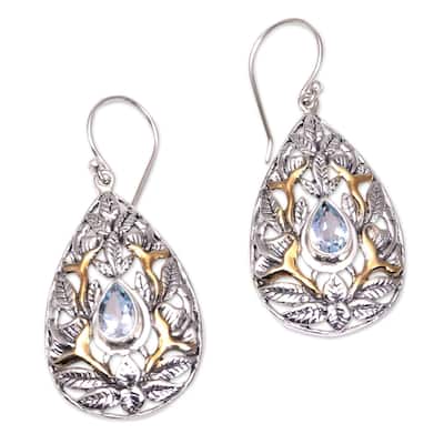 NOVICA Hidden Jungle, Gold accented blue topaz dangle earrings - 1.8*0.8