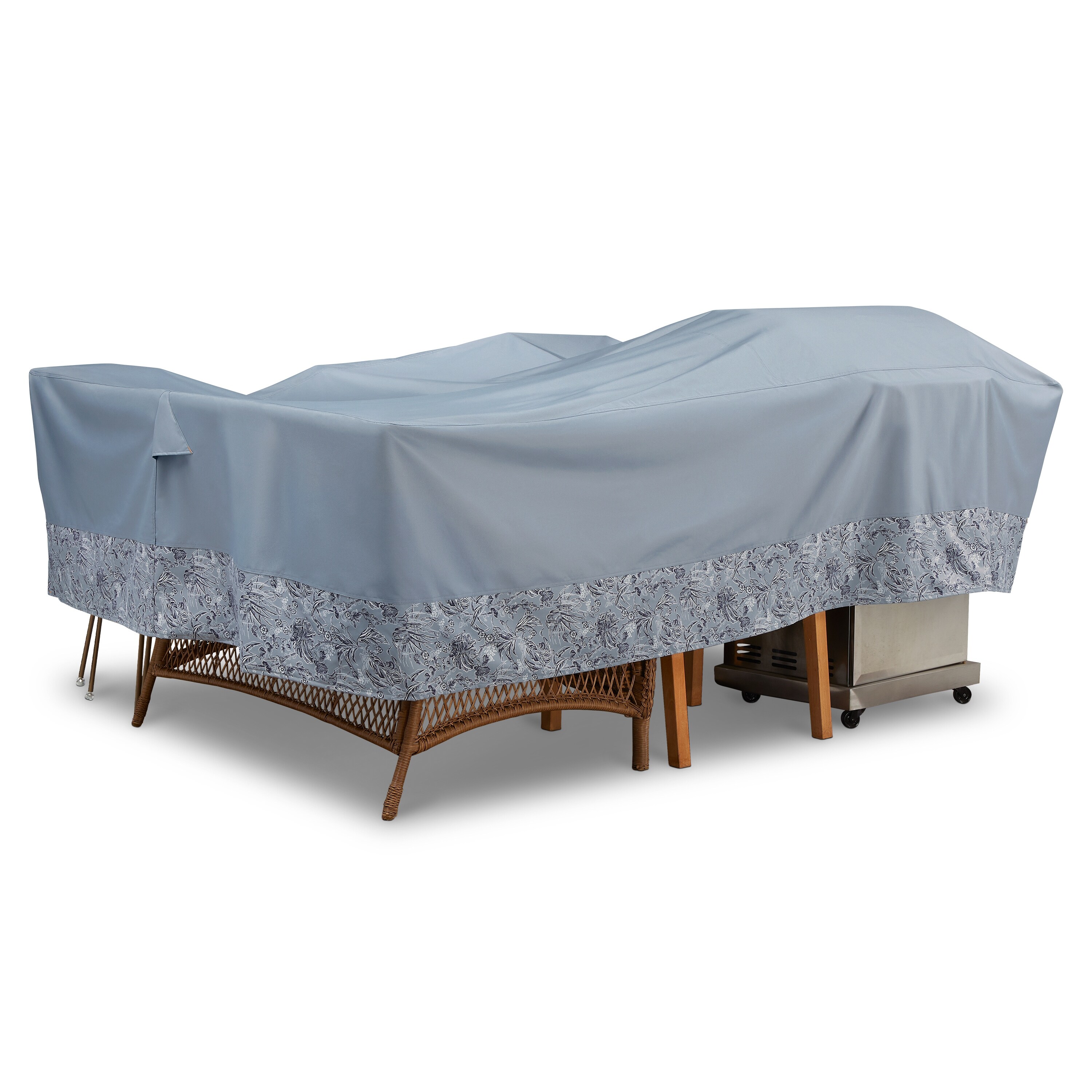 Outdoor furniture set covered with a light blue fitted cover, hiding sofa and chairs with a wicker base and a metallic cart on the side.