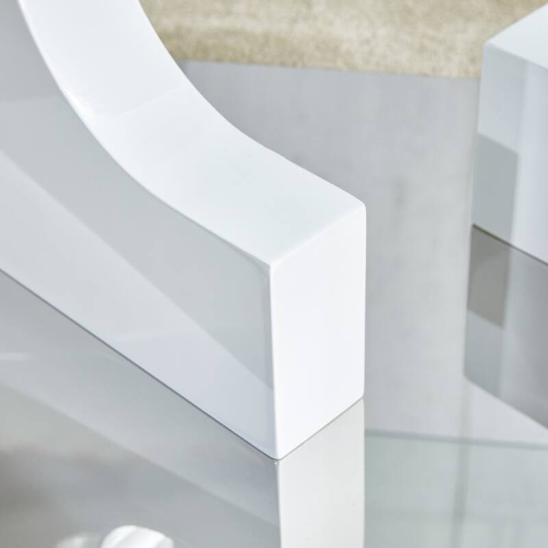 A rectangular modern and fashionable coffee table with tempered glass tabletop and black MDF legs