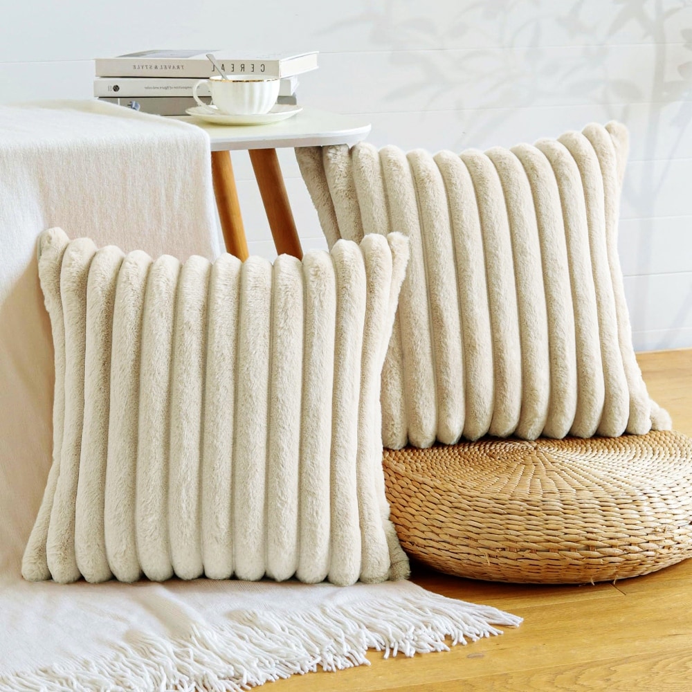 White furry couch pillows top