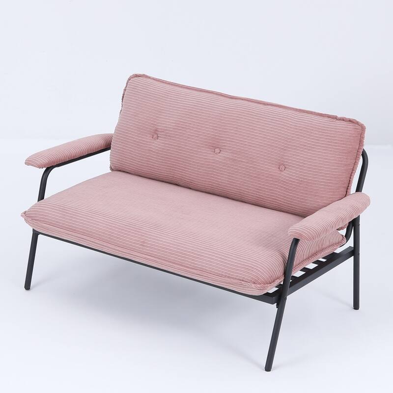 The 53-inch black sofa offers a spacious layout in the small apartment