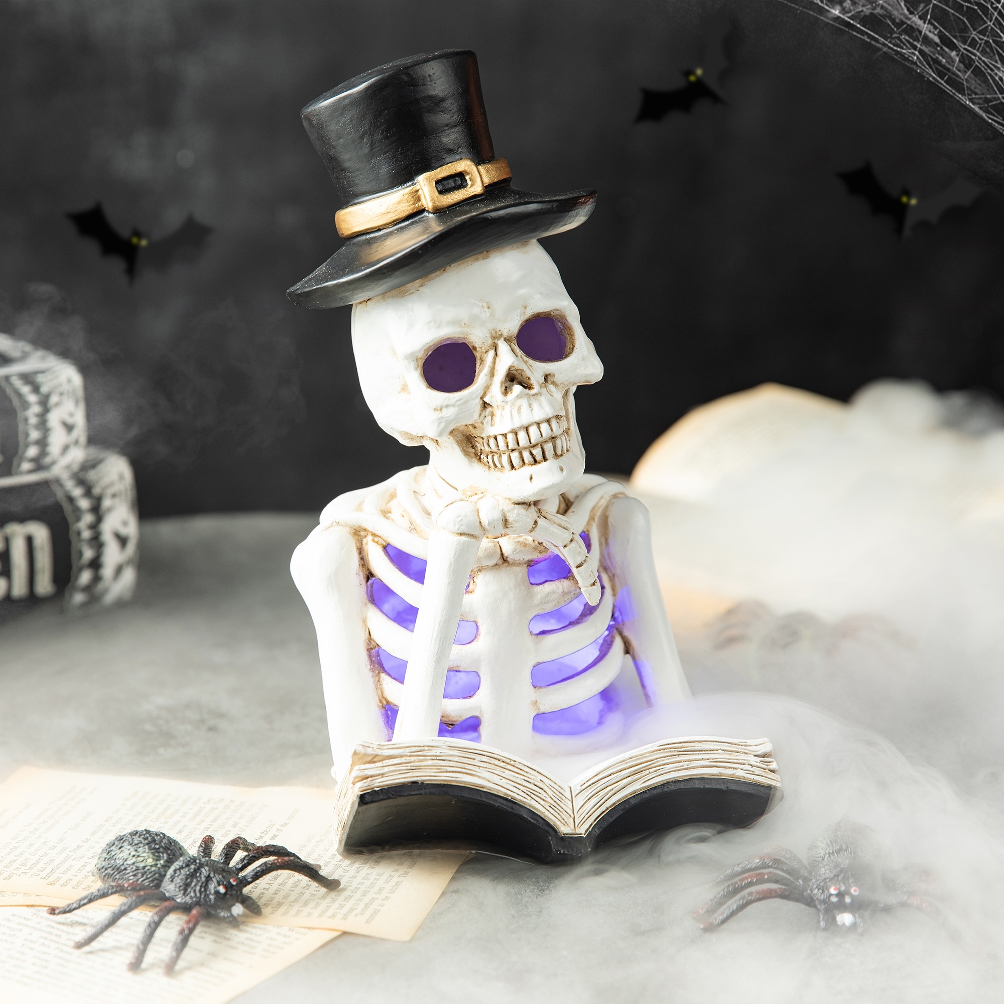 Glitzhome 10.25"H Halloween Lighted Resin Skull Reading Book Figurine Table Decor