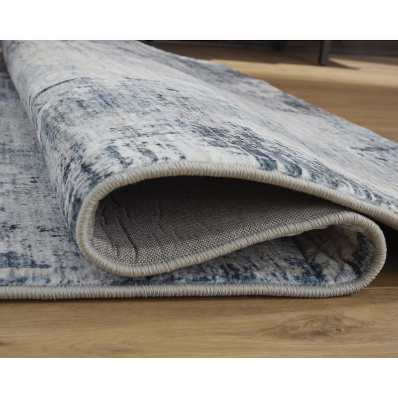 Signature Design by Ashley Arlenmont Blue/White/Brown Memory Foam Area Rug