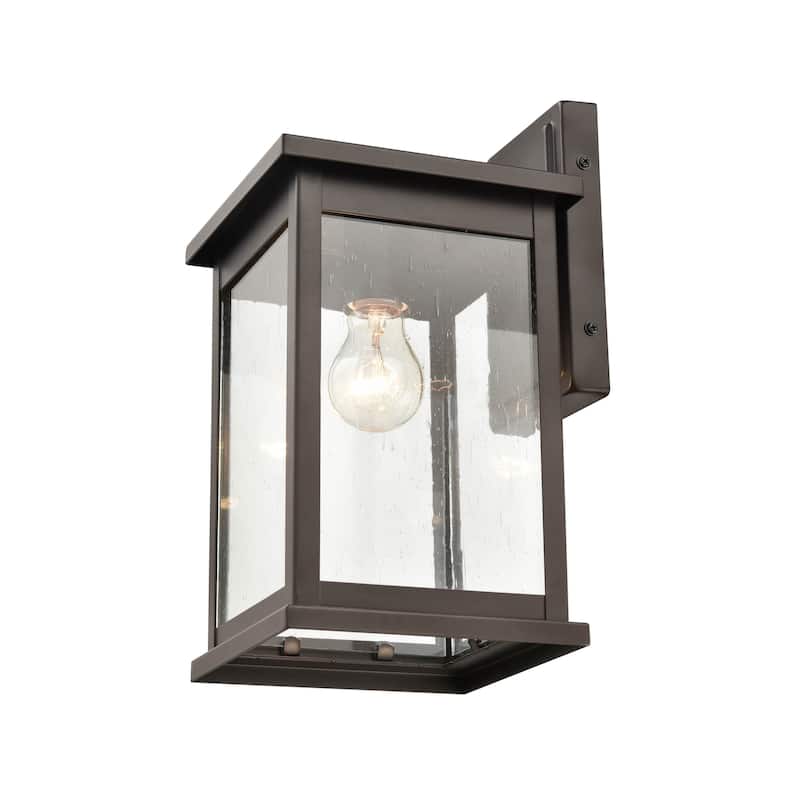 Millennium Lighting Bowton 1 Light Outdoor Wall Sconce in Powder Coat Bronze with a Clear Glass Shade