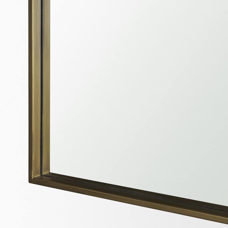 Timon is a square mirror with an arched brushed gold metal frame. - 36.0L x 1.8W x 34.3H