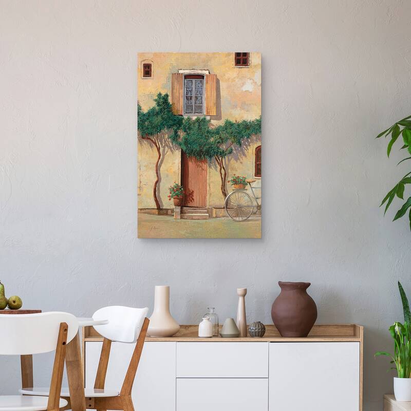 Mezza Bicicletta Sul Muro by Guido Borelli Canvas Art Print