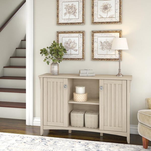 The Gray Barn Lowbridge Antique White Storage Cabinet with Doors - 46.22"L x 12.76"W x 29.96"H. Opens flyout.