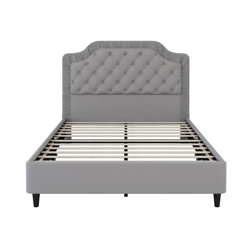 Upholstered bed with pleated trim and button tufted headboard