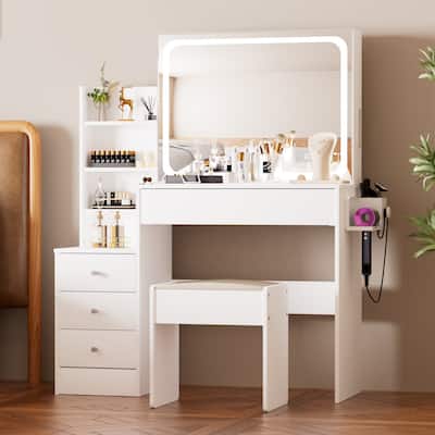 Vanity table with LED-lit mirror with power outlet and hairdryer shelving